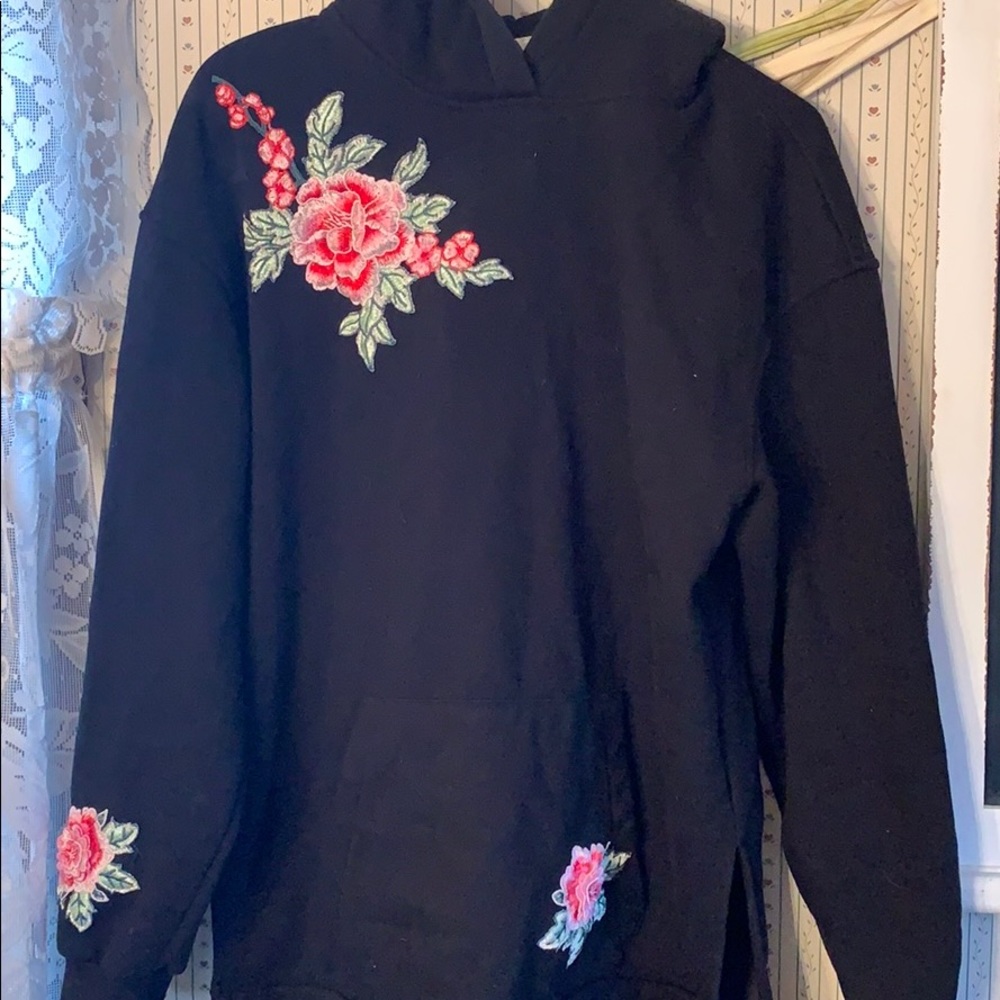 Black hoodie with rose appliqués